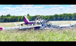 A crop-dusting airplane is shown above burned in a field northeast of Whiting after crashing here Monday afternoon. The pilot, David Brocklehurst, 49, of Vernon, Texas, escaped with no life-threatening injuries after the plane reportedly struck a communication pole that marked a natural gas line before crashing and catching fire.  