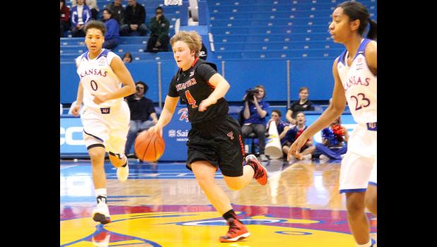 By Kelly Breckunitch Former Wildcat Ryann Bowser (shown above, middle) pushes the ball up the court in recent Big 12 match-up between Texas Tech and Kansas. Bowser joined the Red Raiders this season after a highly successful run at Highland Community College.