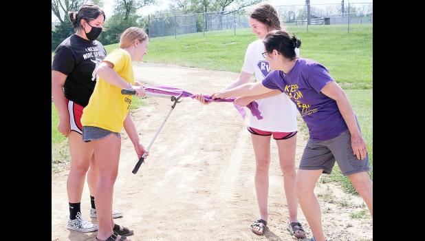Members of the Royal Valley High School KAY Club hosted a ribbon-cutting ceremony to mark the official opening of the new walking and nature trail behind RVHS. KAY Club members shown include (from left) Alyssa Levier, Lilly Rooks and Kennedy Bryan, along with Brenda Lambrecht, KAY sponsor. (Photo by Ali Holcomb)