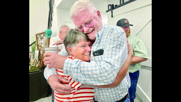 by David Powls Dan Harris, owner of Holton Livestock Exchange, shown above at right, was on hand to meet many of the guests in attendance at HLE’s 75th business year anniversary celebration held last Thursday evening at The Barn On The Prairie. Debby Knouft, also shown in the photo, was one of those in attendance. Knouft worked at HLE as a clerk on Tuesday Sale Day for many years, as did her mother, Ethel Ann King. Debby’s daughter Carly Fletcher also worked for the auction business.