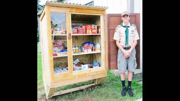Caliber Miller has built five “blessing boxes” — including this large one located next to Mayetta City Hall — for his Eagle Scout project. (Photo by Ali Holcomb)