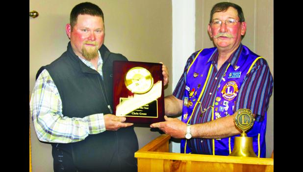 Submitted photo Chris Gross (left) is shown receiving the Farmer of the Year Award from Holton Lions Club member Allen Arnold (right).