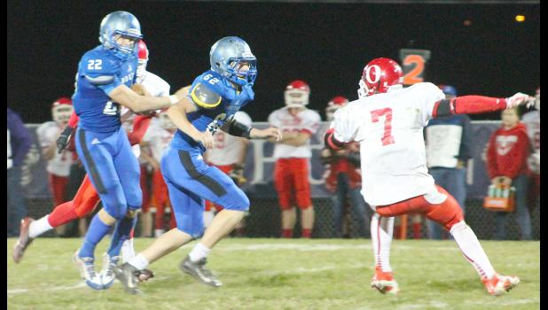 By Kelly Breckunitch HHS running back Indie Allen (shown above, left) follows lineman Dean Klahr (middle left) on one of his three touchdown runs in Holton's 54-8 regional win over Osawatomie.