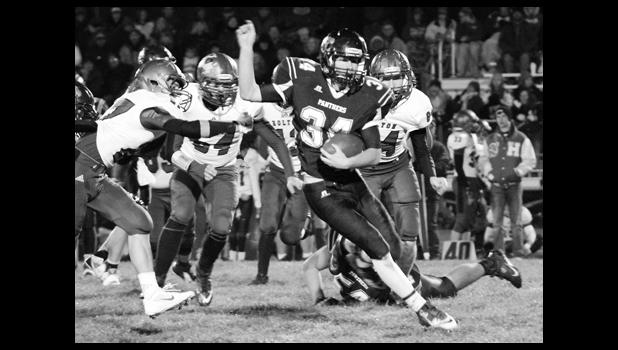 Kelly Breckunitch Panther RB Derrick Barger (shown above, middle) tries to break free from the grasp of Wildcat Justin Pool (left) in the midst of a long run that set up RV's lone touchdown in a 51-6 loss.