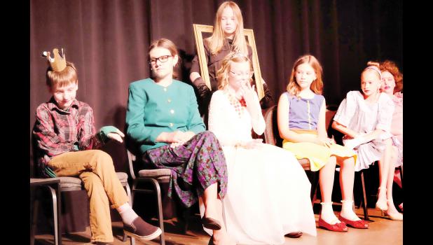 Holton Community Theatre hosted drama camps recently for area students. On June 19, some students performed the play “The Ever After” by Nathan Hartswick. During the play, fairy tale characters are invited to a talk show to reconcile. Cast members shown include (from left) Owen Morris (Emmett Mantella), Stella Kennedy (Jiminy Cricket), Kyla Tanking (queen), Adalyn Binkley (standing, mirror), Violet Kennedy (Snow White), Kizzy Black (Cinderella) and Savannah Varner (Stepsister #1). (Photo by Ali Holcomb)