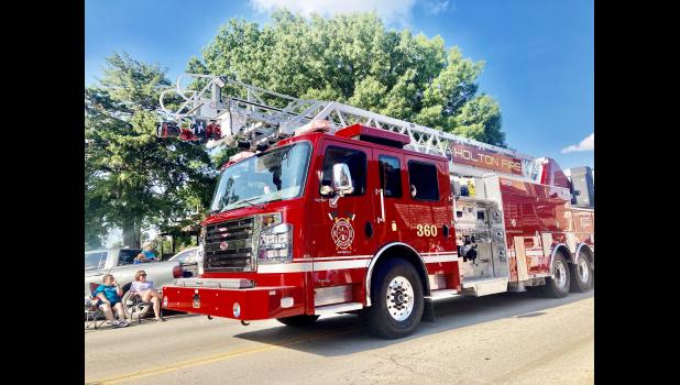Holton Fire Department’s “first-out” fire engine was one of many emergency vehicles from police and fire departments in Jackson County that participated in the annual Jackson County Fair Parade, held Wednesday, July 15, on Holton’s Town Square. The fire engine has been part of the HFD fleet since January 2024. (Photo by David Powls)