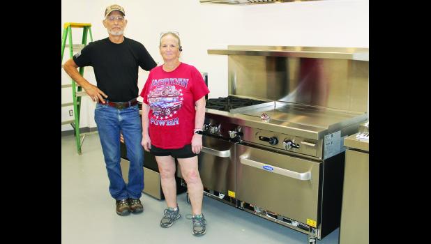 Dave Powelson (shown above at left), Holton VFW Post 1367 quartermaster, and Sharon Spiker (second from left), Mary L. Bair American Legion Auxiliary president, are proud to show off new kitchen equipment now in place at Holton’s Veterans Club, where Saturday morning breakfasts will resume on Aug. 8.