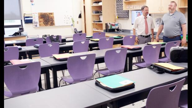 Royal Valley Board of Education President Boone Smith (at left) and Superintendent Aaric Davis (at right) are shown in one of two science classrooms and labs at Royal Valley Middle School that were renovated this summer. Prior to the recent board of education, board members toured the schools to view facility upgrades. (Photo by Ali Holcomb)