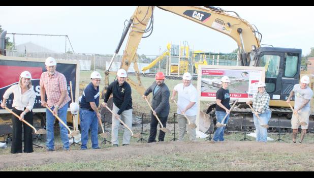 USD 335 school board members and administrators turned ceremonial dirt for the construction of two new school building additions. Shown from left in the photo above are board members Michelle Schierling, Neal Keeler, David Holliday and David Allen, superintendent and elementary principal Jim Howard, middle and high school principal Kevin Vanderbilt and board members Kallie Kirk, Michelle Cochran and Mitch Bagby. (Photo by Brian Sanders)