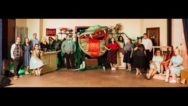 Members of the “Little Shop Of Horrors” cast are shown above and include (from left) Johnny Vaughan, Olyvia Kimberlin, Julia Keling, Daniel Kooser, Lexie Garles, Denis
Jimenez, Bryce Korf, Dusty Nichols and Pat Fontaine inside the plant puppet, Madeline Heineken, Jaelynn Cottrill, Becca Robertson, Brenda Harter, Tristan Schmid, Katie Boyett, Isla Lewis and Rain Cathelle. 