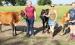 Sharron Holliday (center) of rural Denison and her daughters, Sidney Eisman (at left) and Sophia Holliday (at right) are proud of their small herd of Jersey milk cows. (Photo by Brian Sanders)
