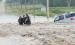 Three people were rescued from floodwaters in Jackson County early Friday morning following heavy rains. In this photo, Holton Police Officers Chad Ballenger (center) and Justin Keller (at right) are shown helping an unnamed flood victim navigate floodwaters after her vehicle was swept off Q.4 Road just north of Holton near Elk Creek. (Photo courtesy of Holton Police Department)