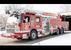 More than two years after the Holton City Commission approved the purchase of a new fire engine with a 109-foot aerial ladder for the Holton Fire Department, that fire engine arrived in Holton on the morning of Thursday, Jan. 11, and Greg Moody of Hays Fire and Rescue Sales and Service is shown backing the fire engine into a rear bay at Holton’s Public Safety Building that morning. (Photo by Brian Sanders)