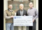 About $216,000 in donations were received during the month of December for the Northeast Kansas Heritage Complex as part of a dollar-for-dollar matching event organized by Denison State Bank. In the photo above, Jackson County Fair Board Association President Aaron Allen (left) received a $100,000 check from Jim Birkbeck (center), chairman of the DSB board, and Mike Day (right), DSB president, on Friday at the exhibit hall at the new fairgrounds. (Photo by Ali Holcomb)