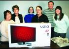 Susie Jacobs of Muscotah (third from right) won a 32-inch TV as part of The Holton Recorder's annual Super Pick'em Contest by correctly guessing that the New England Patriots would win the Super Bowl 28-24. Jacob's submitted her winning entry at Koger Variety. Pictured with Jacobs are Recorder staff members (from left) Shannon Schmille, Connie Powls, Kendra McClain, Brian Sanders and Ali Holcomb.   
