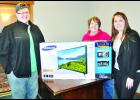 Sam Swindale (at left) of Holton is the winner of The Holton Recorder's 2016 Super Football Sweepstakes. Swindale submitted the closest entry by predicting a 23-10 win for the NFL's Denver Broncos over the Carolina Panthers. The actual score was 24-10 in Denver's favor. Swindale is pictured with Holton Recorder advertising representatives Shannon Schmille (center) and Errin Edwards (right). 