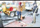 Cliff Givens (left) and P.J. Oldehoeft of Holton’s water and sewer department spent Monday morning, Feb. 22 cleaning out a riser that goes down to a water service line valve on the south side of Holton’s Town Square that was involved in a water line break over the weekend. City water employees and area plumbers noted a significant number of water line breaks due to recent cold weather, it was reported. (Photo by Brian Sanders)