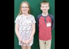 Holton fifth-grade student Owen Morris (at right) won the Jackson County Spelling Bee at Jackson Heights High School last week after correctly spelling “insufferable.” Jackson Heights fifth-grade student Paige Holthaus (at left) was named runner up. (Photo by Ali Holcomb)