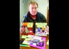Dan Brenner, who serves as president of the newly-formed Jackson County Kiwanis Club, said the mission of Kiwanis is to “improve the world one child and one community at a time.” Brenner is shown above with some of the books the club plans to use in establishing a reading program in the county’s schools. (Photo by Ali Holcomb)