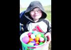 Kids of all ages visited Hoyt City Park the Saturday before Easter for an Easter egg hunt, held by the Hoyt Livewires 4-H Club. After kids finished their hunts, they stopped off to survey what they’d found. Five-year-old Austin Davis is shown with his haul. 