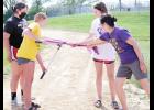 Members of the Royal Valley High School KAY Club hosted a ribbon-cutting ceremony to mark the official opening of the new walking and nature trail behind RVHS. KAY Club members shown include (from left) Alyssa Levier, Lilly Rooks and Kennedy Bryan, along with Brenda Lambrecht, KAY sponsor. (Photo by Ali Holcomb)