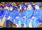 From left, Holton High School seniors Josh Bjelland, Madison Beightel, Samantha Beauchamp, Javier Batista-Alvarez and Mason Barta listened to classmate Alexandria Bontrager give her graduation speech during Saturday’s commencement exercises in the HHS main gymnasium.