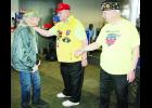 Holton veteran Daniel Amberg (at left) was welcomed by Honor Flight volunteers Joseph Short (center) and Ernest Puls (right) upon arrival at Baltimore-Washington Airport. The trip was a “bucket list” event for Amberg, who died Sunday at his home, hours after returning to Holton. 
