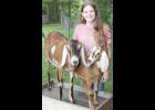 Brooke Slipke of rural Netawaka is shown in the photo above with two of her Nubian dairy goats. June is Dairy Month. (Photo by Brian Sanders)