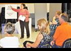Miriam Krehbiel (center), president and CEO of United Way of Greater Topeka, led the discussion during the first of three "community conversation" events to be held in Jackson County this month. The events are to determine additional ways United Way funding can be used to assist with long-term change in the community. Community members pictured during Thursday's event include (from left) Pam Holaday, Sheila and Mike Day and Kelly Sipes. (Photo by Ali Holcomb)