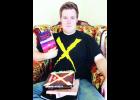 Hoyt native Alex Hounchell is shown above with his published novels. Hounchell recently published his fourth novel, "Running Out Of Time." He is a student at Washburn University. 