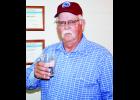 In the photo above, Dennis Ashcraft lifts a glass of water to 40 years with the city’s wastewater treatment plant. 