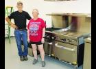 Dave Powelson (shown above at left), Holton VFW Post 1367 quartermaster, and Sharon Spiker (second from left), Mary L. Bair American Legion Auxiliary president, are proud to show off new kitchen equipment now in place at Holton’s Veterans Club, where Saturday morning breakfasts will resume on Aug. 8.