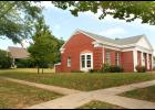 Recently, the board of directors at Beck-Bookman Library (at right) approved the purchase of a house at 410 Kansas Ave., directly behind the library, which Librarian Candee Jacobs said will be demolished in the near future for the future expansion of the library. The purchase price of the house, which was sold at a recent sheriff’s sale at the Jackson County Courthouse, was $98,356, it was reported. (Photo by Brian Sanders)