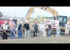 USD 335 school board members and administrators turned ceremonial dirt for the construction of two new school building additions. Shown from left in the photo above are board members Michelle Schierling, Neal Keeler, David Holliday and David Allen, superintendent and elementary principal Jim Howard, middle and high school principal Kevin Vanderbilt and board members Kallie Kirk, Michelle Cochran and Mitch Bagby. (Photo by Brian Sanders)