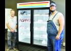Heartland Meat Market opened recently in downtown Holton, offering a wide selection of meats. Shown in the above photo are employee Billy McCauley (left) and owner David Tinney (right). Tinney owns the business with Matt McCauley. 