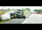 A UPS truck and trailers rolled into the ditch following a two-vehicle accident this morning at the intersection of U.S. Highway 75 and Columbine Drive near Holton Community Hospital. The truck's driver, Daryl Compton of Topeka, as well as the other vehicle's driver, Paul Krogman of Holton, were injured in the accident, and U.S. 75 north of Holton was shut down for more than an hour as a result of the accident. 