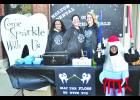 This chili booth from Holton Dental was voted "Best Decorated Booth" by members of the public during Saturday's chili cook-off in Holton, which was a fund-raiser for Banner Creek Science Center and Observatory. Those pictured are (from left) Whitney Benjamin, Jayme Benjamin, Lizzie Doud and Jaimon Benjamin, who was dressed like a spaceship. (Photo by Ali Holcomb)