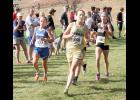 In this photo, Jackson Heights High School sophomore Faith Little (center) held the lead over cross country runners Madeline Hess (left) of Wabaunsee High School and Halle Johnson (right) of Bennington High School during Saturday’s Class 2A state cross country meet in Wamego. (Photo by Brian Sanders)