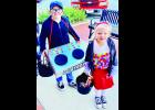 In the photo above at right, Bryson York (at left), 9, was dressed as a DJ for the Halloween event around the Holton Square while his sister, Demi, 5, was dressed as a gumball machine. Their par ents are Chris and Ashlee York, and their grandparents are Gordon and Carol Lamme.