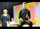Royal Valley High School is set to perform the murder mystery play “Cooking Can Be Murder” this Friday and Saturday at the elementary gymnasium in Hoyt. In the photo above, Hedda Hare, played by Allison Clements (left), argues with cooking judge James Valentino Casanova Bond, played by Kyle Meyer (right) as Bond explains that he plans to blackmail Hare. Characters shown in the background include Howie Diddot, played by Karsen Smith (back left) and Jane Smith, played by Taylor Holte. (Photo by Ali Holcomb)