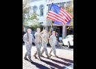 A color guard from Holton’s National Guard armory carried the U.S. and Kansas flags at the front of Wednesday's Veterans Day parade. Shown from left are Spc. Dustin Feldman, Ssg. Christopher Horns, Sgt. Colton Feldman and SSgt. Duane Forbes. (Photo by Brian Sanders)