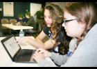 Holton High School juniors Madi Lira (center) and April Utterback (right) used the Tinkercad computer-aided drawing program to create a Thanksgiving turkey during their participation in a Thursday morning STEM curriculum course at Banner Creek Science Center. Lira said she was “getting a little bit frustrated” that the turkey wasn’t turning out how she expected, but Utterback added, “this is probably one of our better ones.” (Photo by Brian Sanders)