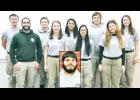 Members of the AmeriCorps team serving in Jackson County until Dec. 18 include (front row, from left) team leader Julian Jordan, Barrie Schmitt, Linna Bounxayavong; Audrey Snyder, (back row, from left) Steve Phillips, Alec Bandemier, Amanda Iscoa, Isaac Dahl, Katie Olson and Jesse Mitts (inset). Not pictured is Erica Blue. (Photo by Ali Holcomb)
