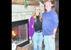 Cheryl (left) and Gerald Copeland of Holton have transformed a blacksmith shop into a beautiful rustic home for their family. The Copelands’ home is one of five featured stops on this year’s Holton Christmas Homes Tour, set from 10 a.m. to 3 p.m. on Saturday, Dec. 12. (Photo by Ali Holcomb)