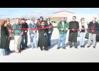 Holton Mayor Robert Dieckmann (fourth from right) cut the ceremonial ribbon on the recently-completed concrete street that runs through Holton Industrial Park on Tuesday afternoon while business owners in the park and city officials looked on.