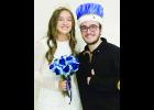 In the photo above, Holton High School seniors Natalie Willcott (at left) and Braun Teter (at right) were named winter royalty queen and king during the HHS wrestling dual against Spring Hill.