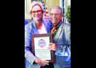 In the photo above, Jackson County native Clyde Cozad (at right) is shown with former Hickman Mills High School basketball standout Kathleen Kunkler (at left) after Cozad and the Hickman Mills teams from 1977 to 1980 were inducted into the Missouri Sports Hall of Fame.