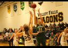 Jackson Heights senior Hannah Williams (22 in the green jersey)  goes up for a shot in the paint against the Lady Dragons of Valley Falls on Tuesday, Jan. 3 in the 42-19 loss.