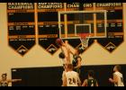 Jackson Heights senior Wyatt Olberding (11 in the dark jersey) blocks a shot in the 64-35 win over the Dragons on Tuesday, Jan. 3.