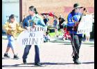 Prairie Band Potawatomi Tribal members (from left) SahBi Potts, Knowee Potts and Keesis Potts are shown above holding signs in protest of the proposed Dakota Access Pipeline during the Mayetta Pioneer Day parade on Saturday, Aug. 10. (Photo by Ali Holcomb)